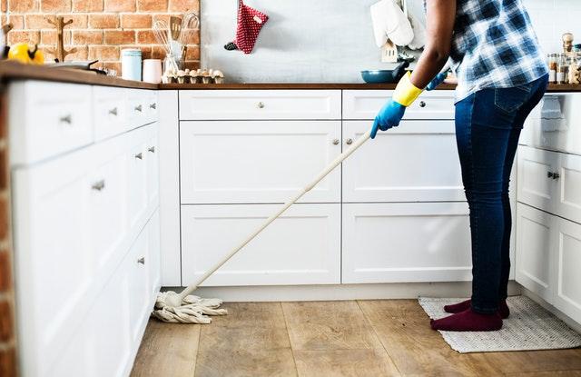 woman mopping floor